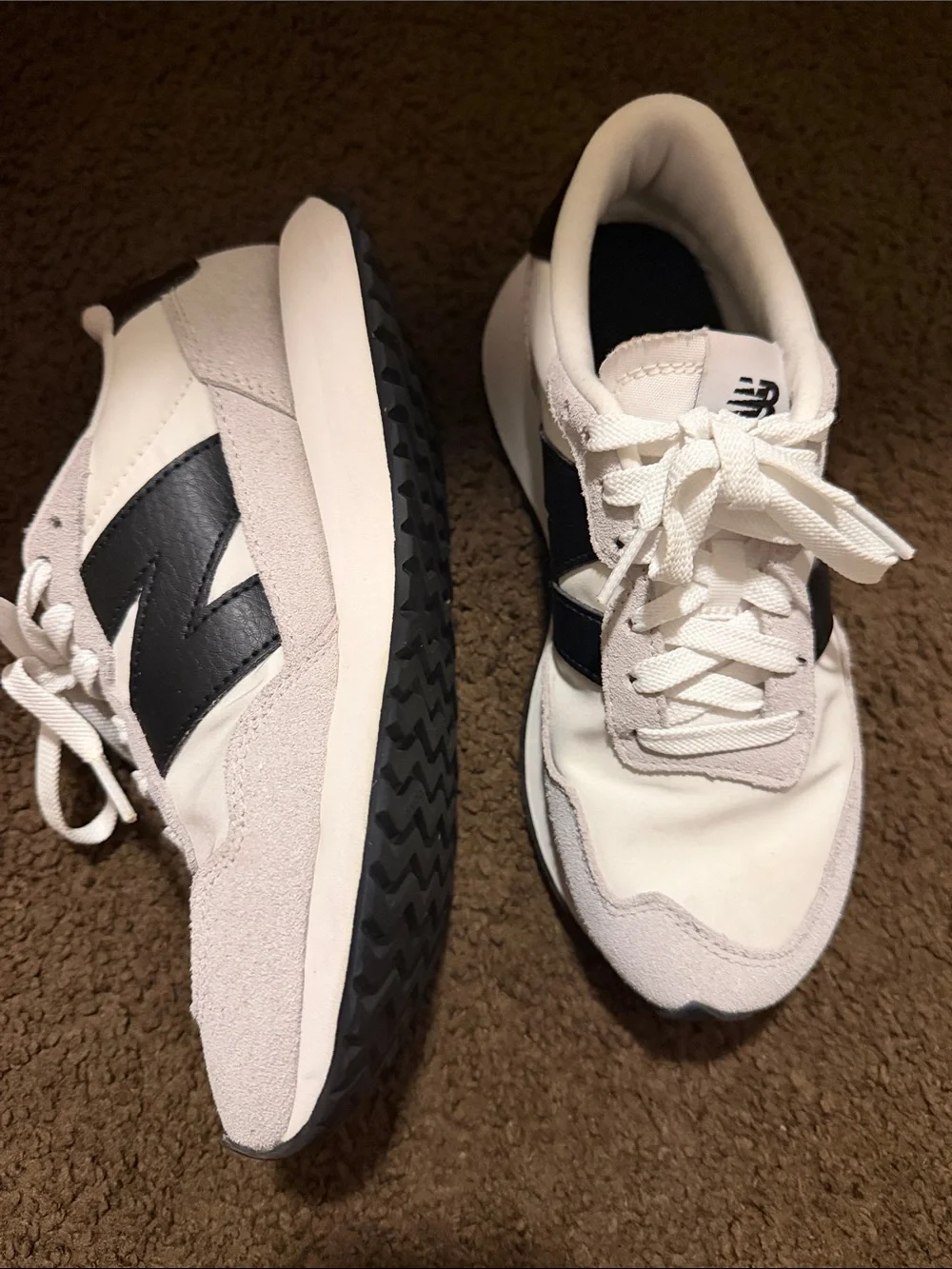 New Balance White Sneakers with Black Logo and Gray Suede